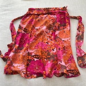 New skirt (washed but never worn). Polyester, light material.